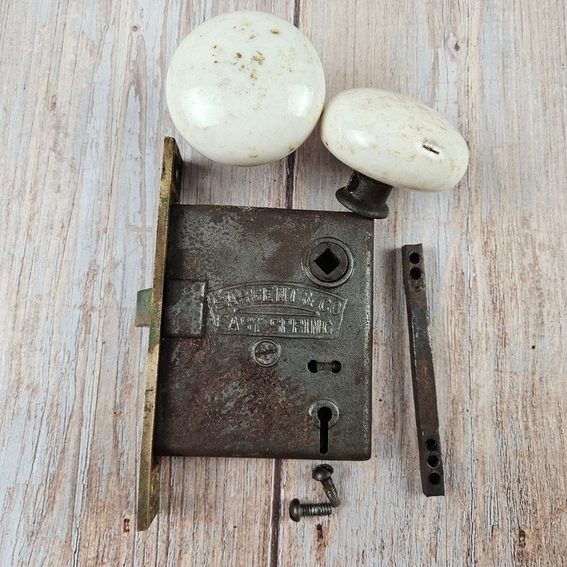 Sargent & Co Easy Spring brass door lock with porcelain knobs 1881 vintage