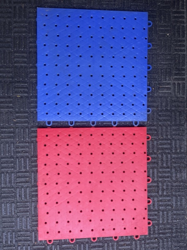 Blue And Red Plastic Garage Floor Interlocking Tiles.