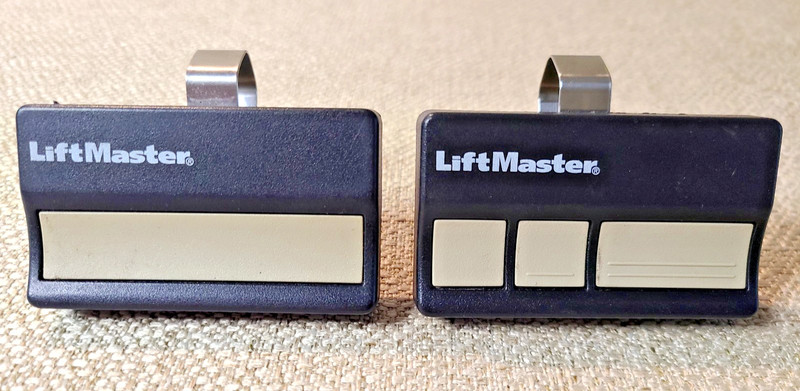 Pair of Liftmaster Garage Door Opener Remotes w/clips 973LM & 971LM