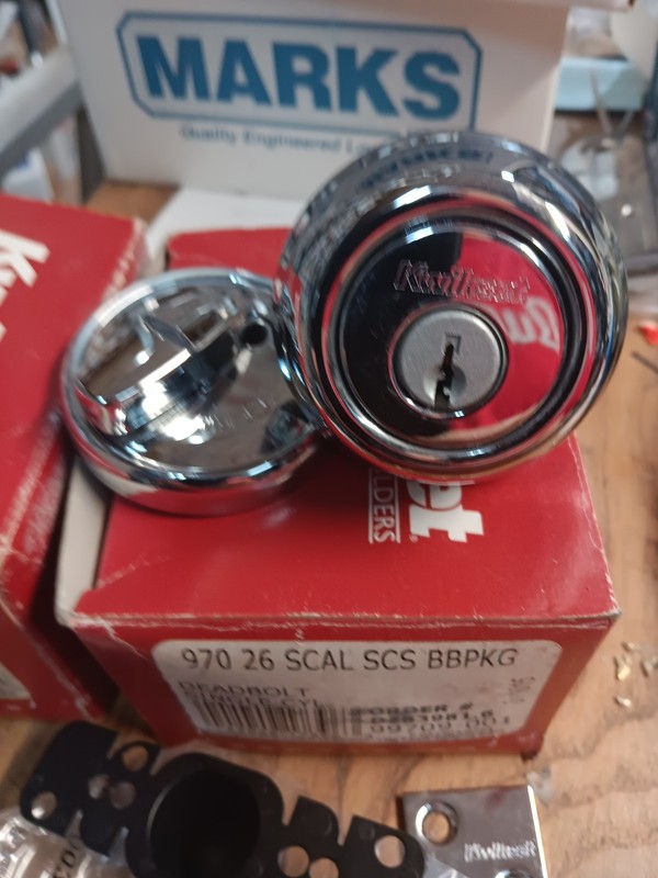 kwikset 2 h.d. s.c. deadbolts keyed alike. polished chrome